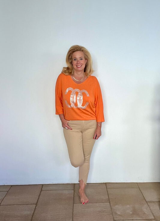 Pullover mit Strassaufschrift in orange und schwarz